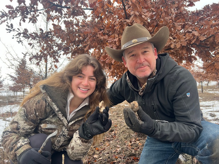 Ken Fry and daughter Audrey Fry holding first truffles (T. borchii) at Homer Fry orchard.